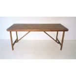 A large pine trestle table, length 183cm, width 69cm, height 78.5cm.