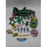 A collection of Thunderbirds toys including four Thunderbird 2 spaceships, figurines, die-cast,