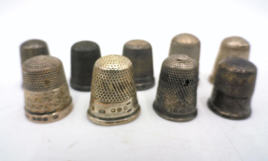 A small collection of nine hallmarked silver thimbles, some A/F.