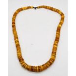 A Baltic amber necklace consisting of graduating butterscotch discs, weight 85.8g