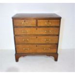 A Georgian oak chest of five drawers with mahogany banding, raised on bracket feet (one A/F), length