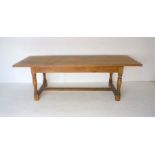 An oak refectory table with pine base, along with a set of six oak upholstered dining chairs with