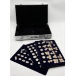 Three trays of modern UK coinage along with a carry case including a number of uncirculated 10p's,