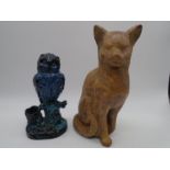 A pottery model of a cat along with a blue glazed figure of an owl spill vase in naturalistic