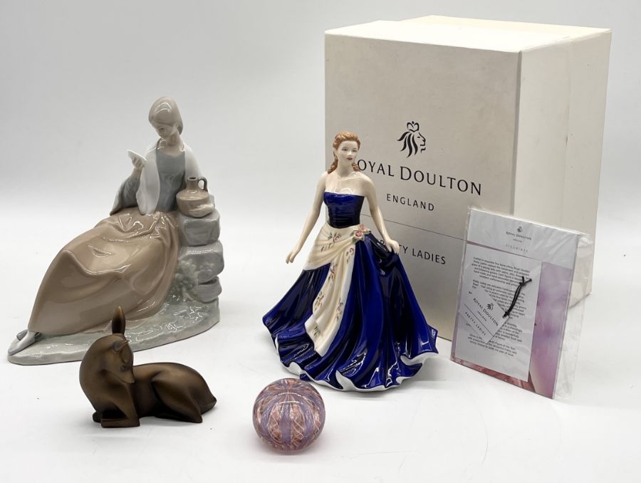 A collection of ceramics including boxed Royal Doulton Olivia, Nao seated lady, Coalport Serenity