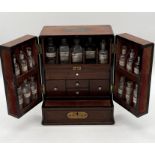 19th century mahogany travelling apothecary cabinet with recessed brass carry handle to top and twin