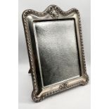 A freestanding hallmarked silver dressing table mirror, Chester 1909