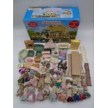 A collection of Sylvanian Families toys including figures, selection of furniture, boxed Woodland