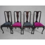 A set of four Queen Anne style dining chairs upholstered in a contemporary fabric.