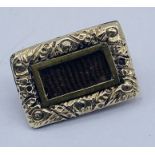 A small Georgian yellow metal mourning brooch