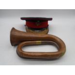 A military cap by Hebert Johnson along with a brass and copper Besson & Co. bugle