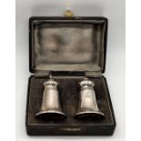 A cased hallmarked silver salt & pepper set