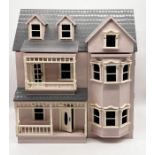 A vintage pink dolls house