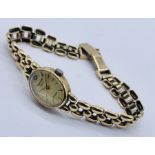 A 9ct gold Accurist Diamond ladies wristwatch with 9ct strap- total weight including movement 16.4g