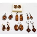 A collection of 925 silver earrings all set with amber