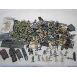 A large collection of plastic military/army toy figurines including Airfix WW2 Gurkhas, along with a