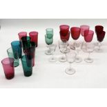 A collection of mainly antique Victorian coloured glasses and beakers