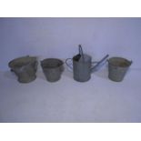 A collection of four galvanised items including buckets, watering cans etc
