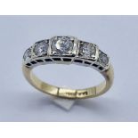 A diamond five stone ring set in 9ct gold