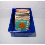 A quantity of 7" vinyl records including Bob Dylan, Adam and the Ants, Elvis Presley, Rainbow, Wham,