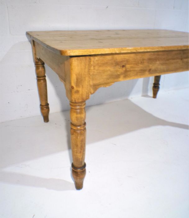 A pine farmhouse table with single drawer, length 138cm, width 86cm, height 73cm. - Image 7 of 7