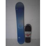 A Joyride snowboard along with a "Mad Skull" skateboard