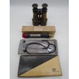 A pair of J B Thomas, Southampton binoculars along with a boxed stethoscope and a vintage Air Force,