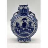 A 19th century Chinese blue and white moon flask with dragon formed handles (repair to one as shown)