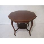 An Edwardian inlaid octagonal centre table on cabriole legs