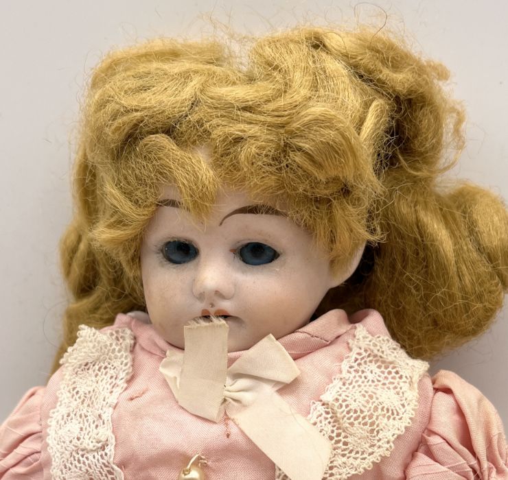 An Ernst Heubach bisque headed antique doll marked with a horseshoe "Made in Germany" 1900 13/O - Image 2 of 4