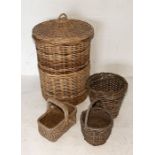 A collection of wicker baskets including large lidded example