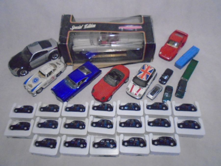 A collection of die-cast cars including 19 Corgi Olympic 2012 boxing London Black Taxi's, Maisto