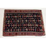 A South American style hand woven rug with repeating pattern 105cm x 154cm