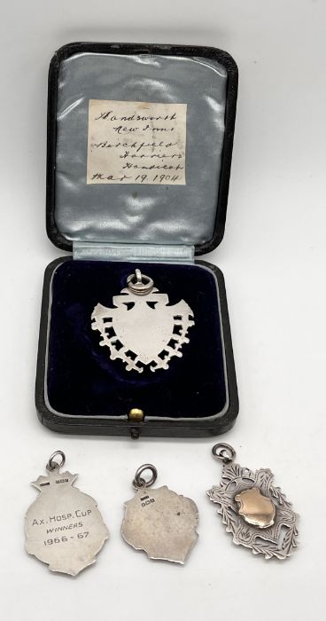 An unmarked silver and gold medallion in fitted case along with three silver medallions - Image 2 of 2