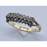 A 9ct gold dress ring set with diamonds