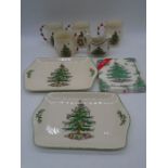A collection of four Spode "Christmas Tree" mugs with candy cane handles, along with a similar
