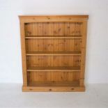 A pine freestanding bookcase, length 106cm, height 127cm.