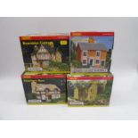 A collection of four boxed Hornby Skaledale OO gauge scale model buildings including Bramble Cottage