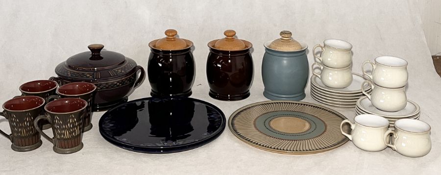 A collection of various Denby storage jars, platters etc including Luxor, Shiraz and Baroque