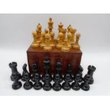 A large wooden chess set in mahogany box (1 pawn A/F- height of King 12.5cm)