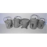 A collection of galvanised items including vintage watering cans, milk churn, etc