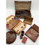 A collection of vintage games including wooden building blocks, Meccano, travel chess boards,