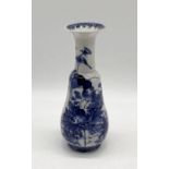 A 19th century Chinese blue and white vase. Hairline crack to side.