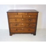 A Georgian mahogany chest of three drawers, with boxwood stringing and three secret drawers,