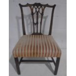 A Chippendale style chair with carved detailing to back.