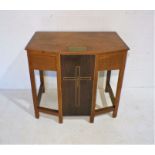 An ecclesiastical oak side table with brass memorial plaque.