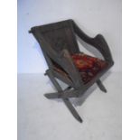 A Gothic style oak Glastonbury chair