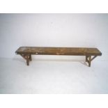 A rustic wooden folding bench, length 182cm, height 38cm.