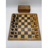 A vintage chess set with Chad Valley Games chess and draught board