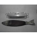 A wooden and aluminium salmon serving plate, along with fish kettle